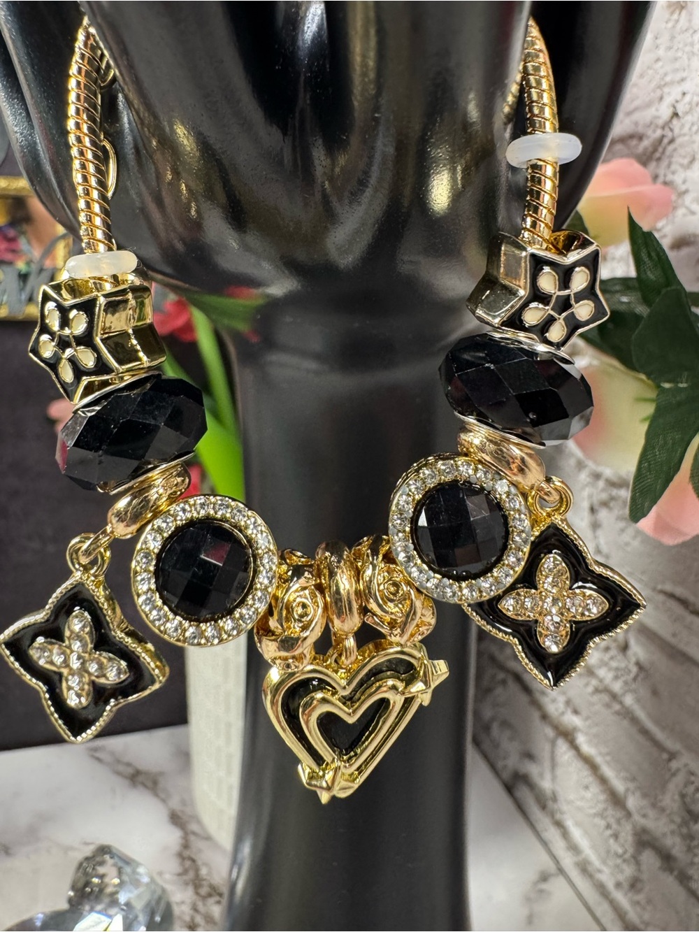 Gold-Tone Black Crystal Charm Bracelet with Heart & Floral Accents